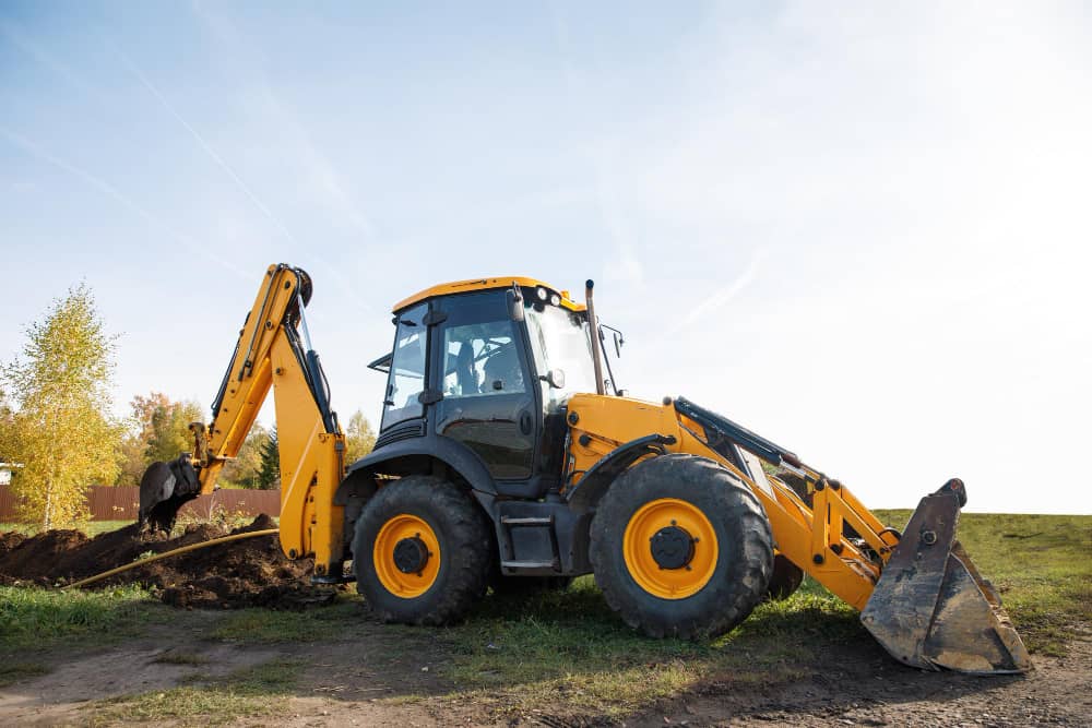 Buldoexcavator în acțiune - Servicii Complete de Construcții